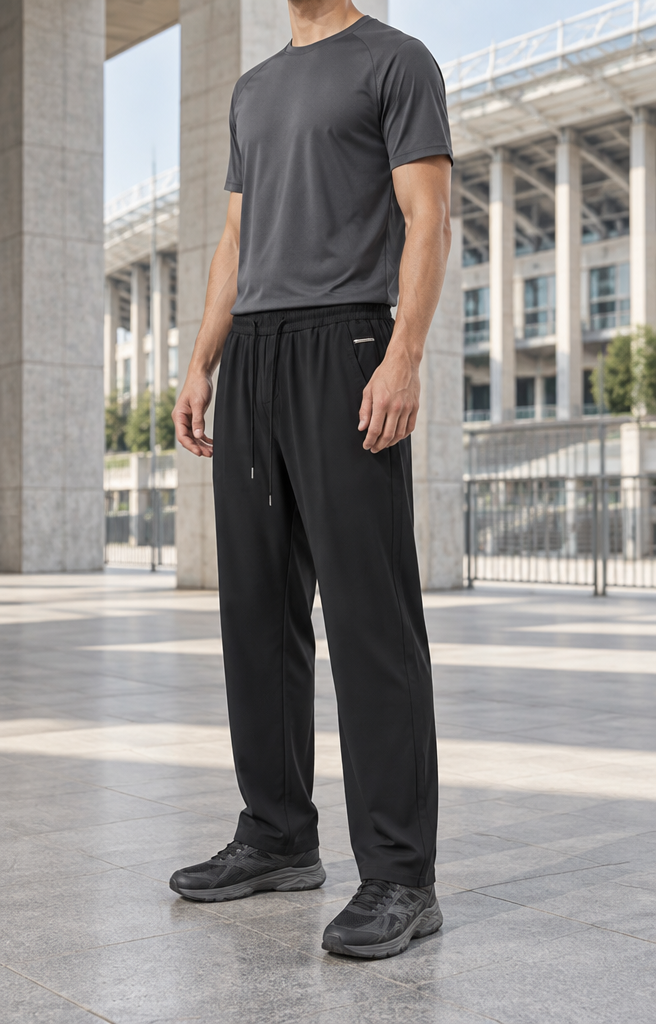 On-model photoshoot (studio)
Show the garment from the image worn by a professional fashion model standing in a professional photo studio with a clean seamless background and soft editorial lighting. Reproduce the garment's exact design, color, fabric and details faithfully. Full-body shot, photorealistic, no text. Additional instructions: Premium men's sportswear e-commerce photography of the EXACT sports trousers or sports shorts from the supplied product reference.
The supplied LOWER GARMENT is the ABSOLUTE PRODUCT REFERENCE and the MAIN PRODUCT.
This prompt must work universally for different types of men's sports trousers and sports shorts.
The final image must look like a premium contemporary men's sportswear campaign photographed in a modern architectural sports environment inspired by the Luzhniki sports complex in Moscow.
PRODUCT — ABSOLUTE PRESERVATION:
Use the EXACT sports trousers or sports shorts from the supplied product image.
Preserve the exact:
design,
color,
shade,
fabric,
material,
fabric texture,
surface finish,
silhouette,
fit,
proportions,
rise,
waistband,
elastic waistband if present,
drawstrings if present,
drawstring color,
drawstring length,
pockets,
pocket placement,
pocket openings,
zippers if present,
side panels if present,
contrast inserts if present,
logos if originally present,
stitching,
seams,
cuffs if present,
elastic cuffs if present,
leg width,
leg length,
shorts length,
hem width,
and every other original construction detail.
The generated product must look like the EXACT SAME physical garment as the source photograph.
Do NOT redesign the product.
Do NOT change its color.
Do NOT change its shade.
Do NOT change the material.
Do NOT change the texture.
Do NOT change the fit.
Do NOT make it slimmer.
Do NOT make it wider.
Do NOT make it tighter.
Do NOT make it oversized.
Do NOT shorten it.
Do NOT lengthen it.
Do NOT add details.
Do NOT remove details.
Do NOT add logos that are not present.
Do NOT remove original logos or details.
The SOURCE PRODUCT determines the exact silhouette.
SPORTS TROUSERS:
If the supplied product is sports trousers, preserve their EXACT original fit.
They may be:
straight,
relaxed,
tapered,
jogger-style,
wide,
technical,
training-style,
or another sportswear silhouette.
DO NOT automatically convert all sports trousers into joggers.
DO NOT automatically taper the ankles.
DO NOT automatically make them straight.
Follow the supplied product EXACTLY.
If cuffs are present, preserve them.
If the legs are open-hem, preserve the open hem.
If the trousers are straight, keep them straight.
If they are relaxed, keep them relaxed.
If they are tapered, preserve the exact original taper.
SPORTS SHORTS:
If the supplied product is sports shorts, preserve the EXACT original:
length,
leg width,
rise,
waistband,
hem,
volume,
and silhouette.
The shorts may be:
training shorts,
technical shorts,
relaxed sports shorts,
football-inspired shorts,
running-inspired shorts,
basketball-inspired shorts,
or premium lifestyle sports shorts.
Follow the SOURCE PRODUCT exactly.
Do NOT automatically make the shorts shorter.
Do NOT automatically make them oversized.
Do NOT change their original proportions.
POSE — KEEP THE ESTABLISHED POSE:
Use the same established model stance.
The model stands in a subtle THREE-QUARTER / SEMI-SIDE position.
The body must NOT be completely front-facing.
The LEFT SHOULDER is slightly FORWARD and slightly CLOSER TO THE CAMERA.
The RIGHT SHOULDER is slightly FARTHER BACK.
The LEFT SIDE of the torso is slightly closer to the camera.
The hips follow the same subtle three-quarter rotation.
The body rotation should remain subtle and natural, approximately 10–15 degrees.
LEFT SHOULDER FORWARD is mandatory.
Do NOT mirror the pose.
Do NOT place the right shoulder forward.
Do NOT create a strong side profile.
LEGS — ABSOLUTELY CRITICAL:
The LEFT LEG is positioned slightly FORWARD and slightly CLOSER TO THE CAMERA.
The RIGHT LEG remains slightly BEHIND.
LEFT LEG FORWARD is mandatory.
The difference between the two legs must remain subtle and natural.
The LEFT FOOT should be approximately 5–10 cm ahead of the RIGHT FOOT.
Both legs remain STRAIGHT.
Both knees remain naturally straight.
Both feet remain firmly planted on the ground.
THIS IS A STATIC STANDING POSE.
Do NOT create a walking pose.
Do NOT create a running pose.
Do NOT create a stepping pose.
Do NOT cross the legs.
Do NOT bend one knee dramatically.
Do NOT create an exaggerated athletic stance.
Do NOT create a wide stance.
The pose should feel athletic but calm, confident and premium.
ARMS AND HANDS:
Both arms hang naturally and STRAIGHT DOWN alongside the body.
Both hands remain relaxed beside the outer thighs.
Hands relaxed.
Fingers naturally relaxed.
No hands in pockets.
No crossed arms.
No hands on hips.
No touching the clothing.
No exaggerated athletic gestures.
No running posture.
No fitness pose.
No flexing muscles.
The styling should look like premium sportswear catalogue photography rather than an active workout photograph.
UPPER BODY — AUTOMATIC SPORTS STYLING:
Choose a premium SPORTY T-SHIRT automatically according to the specific color and style of the supplied sports trousers or shorts.
The T-shirt must complement the lower garment naturally.
The AI may independently choose the most appropriate T-shirt color.
Possible colors include:
black,
charcoal,
graphite,
dark grey,
medium grey,
light grey,
white,
off-white,
cream,
navy,
dark navy,
brown,
taupe,
olive,
or another sophisticated muted athletic color.
DO NOT use the same T-shirt color for every product.
Choose the T-shirt color specifically for EACH supplied pair of sports trousers or shorts.
The T-shirt should look:
premium,
athletic,
minimalist,
modern,
clean,
masculine,
and understated.
Use a contemporary premium sportswear fit.
Not excessively tight.
Not oversized unless it naturally complements the product.
No loud graphics.
No large prints.
No random branding.
No bright patterns.
The T-shirt should visually support the lower garment without becoming the main product.
IMPORTANT:
THE SPORTS TROUSERS OR SHORTS ARE FIXED.
THE T-SHIRT IS FLEXIBLE.
SELECT THE T-SHIRT ACCORDING TO THE COLOR AND STYLE OF THE SUPPLIED LOWER GARMENT.
FOOTWEAR — SPORTY AND AUTOMATICALLY COORDINATED:
The model MUST wear SPORTY FOOTWEAR.
Choose modern premium athletic sneakers that naturally complement the supplied sports trousers or shorts and the selected T-shirt.
The footwear must have a clearly SPORTY appearance.
Suitable styles include:
premium lifestyle sneakers,
modern training-inspired sneakers,
sleek running-inspired sneakers,
minimalist technical sneakers,
contemporary athletic sneakers,
or refined sportswear sneakers.
The sneaker color must be selected independently according to the complete outfit.
Possible colors include:
black,
charcoal,
graphite,
grey,
silver-grey,
dark navy,
brown-grey,
taupe,
beige,
off-white,
or a sophisticated combination of neutral athletic colors.
DO NOT automatically use white sneakers.
DO NOT use the same sneakers for every outfit.
DO NOT use formal shoes.
NO loafers.
NO derby shoes.
NO oxfords.
NO classic leather business shoes.
The footwear must clearly communicate SPORTSWEAR.
Choose the sneakers specifically for EACH outfit.
SOCKS:
If socks are visible, use clean premium athletic socks appropriate for the outfit.
For sports shorts, socks may be more visible and should be intentionally coordinated with the sneakers and shorts.
Keep them minimalist.
No loud graphics or unnecessary branding.
COMPOSITION — SPORTS TROUSERS:
If the supplied product is LONG SPORTS TROUSERS:
Create a vertical FULL-BODY sportswear catalogue photograph.
Show the model from approximately the LOWER CHIN / NECK AREA all the way down to the shoes.
NO FACE VISIBLE.
The eyes, nose and main facial features remain outside the frame.
A small portion of the lower chin / jawline and neck may be visible.
Show:
complete sports T-shirt,
both arms,
both hands,
complete sports trousers from waistband to hem,
both complete legs,
and both complete sneakers.
DO NOT crop the trousers.
DO NOT crop the shoes.
The lower garment must remain clearly visible and visually dominant.
COMPOSITION — SPORTS SHORTS:
If the supplied product is SPORTS SHORTS:
Use a sufficiently wide vertical composition to clearly show:
lower chin / neck,
complete sports T-shirt,
both arms,
both hands,
complete shorts,
both complete bare lower legs,
socks if visible,
and both complete athletic sneakers.
NO FACE VISIBLE.
The complete shorts must be clearly visible from waistband to hem.
The legs and footwear must also be fully visible so the outfit looks complete and intentionally styled.
CAMERA:
Natural premium sportswear catalogue perspective.
Camera positioned approximately around WAIST / LOWER-TORSO HEIGHT.
Use a natural moderate focal length suitable for fashion photography.
No wide-angle distortion.
No dramatic perspective.
No exaggerated legs.
No oversized feet.
No distorted hands.
The camera observes the model from the same subtle three-quarter orientation.
The LEFT side of the model remains slightly closer to the camera.
LOCATION — LUZHNIKI-INSPIRED SPORTS ENVIRONMENT:
Photograph the model in a premium modern sports environment inspired by the architecture and atmosphere of the Luzhniki sports complex in Moscow.
The location should immediately feel SPORTY, architectural and contemporary.
This is NOT the previous classic interior studio.
NO decorative wall moulding.
NO classic parquet.
NO luxury apartment interior.
Instead, create a refined contemporary sports-complex environment.
Use visual elements inspired by a premium stadium / sports complex setting such as:
modern concrete architecture,
large architectural columns,
clean stone surfaces,
large glass sections,
metal architectural details,
wide pedestrian areas,
subtle stadium architecture,
sports-complex corridors,
premium outdoor concourse areas,
or modern covered stadium walkways.
The environment should feel connected to a major professional sports venue.
LUZHNIKI ATMOSPHERE:
The location should evoke the visual atmosphere of the Luzhniki sports complex without distracting from the clothing.
Use:
monumental but clean sports architecture,
modern stadium-scale proportions,
neutral stone and concrete,
glass,
metal,
wide open architectural space,
and subtle sports-infrastructure cues.
The background may show a softly recognizable stadium-inspired architectural structure.
Keep the location realistic and sophisticated.
Do NOT create a football match.
Do NOT place the model on the middle of a football pitch.
Do NOT create a crowded stadium.
Do NOT add football players.
Do NOT add athletes around the model.
Do NOT add spectators.
Do NOT add a crowd.
Do NOT add random sports equipment.
Do NOT add footballs unless explicitly requested.
Do NOT create a gym interior.
Do NOT create an artificial studio backdrop.
The result should feel like a premium sportswear campaign photographed around a major sports complex.
BACKGROUND:
Keep the background visually clean and controlled.
Architectural details may remain slightly soft due to natural depth of field, but the sports-complex environment must still be recognizable.
The clothing must remain the sharpest and most important element.
No visual clutter.
No random people directly behind the model.
No cars dominating the background.
No advertisements dominating the frame.
No large random text.
No distracting signs.
LIGHTING:
Use soft natural daylight suitable for premium sportswear photography.
Prefer bright overcast daylight or soft diffused daylight.
The light should accurately reveal:
the exact lower-garment color,
fabric texture,
technical material,
seams,
waistband,
drawstrings,
pockets,
and silhouette.
Use realistic soft shadows.
Maintain fabric detail in black and dark garments.
Do NOT crush black sportswear into flat black areas.
Natural neutral color temperature.
No dramatic sunset.
No harsh midday shadows.
No cinematic orange-and-teal grading.
No artificial studio spotlight.
IMAGE STYLE:
Ultra-photorealistic.
Premium European men's sportswear e-commerce photography.
Modern athletic lifestyle aesthetic.
Contemporary sports fashion.
Natural male anatomy.
Realistic skin texture.
Highly realistic sportswear fabric texture.
Accurate technical fabric appearance.
Accurate garment construction.
Natural fabric folds.
Natural athletic styling.
Soft premium daylight.
Clean commercial catalogue aesthetic.
Sophisticated and understated.
No excessive retouching.
No cinematic effects.
No artificial fabric shine.
STRICT RULES — ABSOLUTELY MANDATORY:
THE SUPPLIED SPORTS TROUSERS OR SHORTS ARE THE MAIN PRODUCT.
PRESERVE THE EXACT ORIGINAL PRODUCT.
PRESERVE EXACT:
COLOR,
SHADE,
MATERIAL,
TEXTURE,
FIT,
SILHOUETTE,
PROPORTIONS,
WAISTBAND,
DRAWSTRINGS,
POCKETS,
LEG WIDTH,
LENGTH,
HEM,
CUFFS IF PRESENT,
LOGOS IF PRESENT,
AND ALL ORIGINAL DETAILS.
DO NOT STANDARDIZE DIFFERENT SPORTS TROUSERS INTO ONE FIT.
FOLLOW THE EXACT FIT OF EACH SUPPLIED PRODUCT.
IF THE PRODUCT IS SHORTS, PRESERVE THE EXACT SHORTS LENGTH AND WIDTH.
SPORTY T-SHIRT SELECTED AUTOMATICALLY ACCORDING TO THE PRODUCT.
SPORTY SNEAKERS SELECTED AUTOMATICALLY ACCORDING TO THE COMPLETE OUTFIT.
DO NOT DEFAULT TO WHITE SNEAKERS.
SPORTSWEAR APPEARANCE IS MANDATORY.
NO FORMAL FOOTWEAR.
NO CLASSIC SMART-CASUAL STYLING.
NO FACE VISIBLE.
SUBTLE THREE-QUARTER / SEMI-SIDE POSITION.
LEFT SHOULDER FORWARD.
RIGHT SHOULDER SLIGHTLY BACK.
LEFT SIDE CLOSER TO CAMERA.
LEFT LEG SLIGHTLY FORWARD.
RIGHT LEG SLIGHTLY BEHIND.
BOTH LEGS STRAIGHT.
BOTH FEET FIRMLY PLANTED.
STATIC STANDING POSE.
NO WALKING.
NO RUNNING.
NO CROSSED LEGS.
NO EXAGGERATED ATHLETIC POSE.
BOTH ARMS STRAIGHT DOWN.
BOTH HANDS RELAXED BESIDE THE THIGHS.
NO HANDS IN POCKETS.
LOCATION:
PREMIUM MODERN SPORTS-COMPLEX ENVIRONMENT INSPIRED BY LUZHNIKI, MOSCOW.
MODERN STADIUM ARCHITECTURE.
CONCRETE / STONE / GLASS / METAL.
WIDE CLEAN SPORTS-COMPLEX SPACE.
NO CLASSIC INTERIOR STUDIO.
NO WALL MOULDING.
NO HERRINGBONE PARQUET.
NO PLAIN SEAMLESS BACKDROP.
NO GYM.
NO CROWDS.
NO FOOTBALL MATCH.
NO RANDOM SPORTS EQUIPMENT.
SOFT NATURAL DAYLIGHT.
PREMIUM MEN'S SPORTSWEAR E-COMMERCE AESTHETIC.
THE PRODUCT MUST REMAIN THE VISUAL FOCUS..