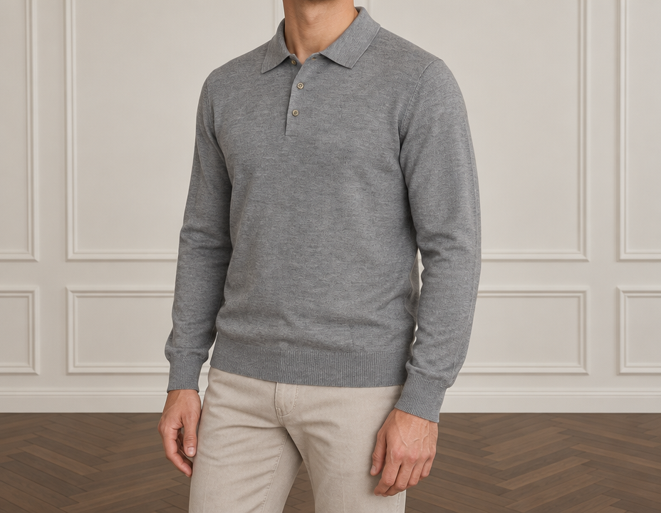 On-model photoshoot (studio)
Show the garment from the image worn by a professional fashion model standing in a professional photo studio with a clean seamless background and soft editorial lighting. Reproduce the garment's exact design, color, fabric and details faithfully. Full-body shot, photorealistic, no text. Additional instructions: Premium men's fashion e-commerce product photography of an outerwear garment, matching the supplied reference image EXACTLY in composition, body position, pose, body rotation, camera angle, proportions, framing and premium studio aesthetic.
The supplied outerwear product image is the absolute product reference.
COMPOSITION:
Upper-body men's fashion catalogue photograph.
Reproduce the SAME framing and proportions as the supplied pose reference.
Show the male model approximately from the LOWER CHIN / NECK AREA down to the UPPER THIGHS.
The FACE must remain outside the frame.
No eyes.
No nose.
No full face visible.
Only a small portion of the lower chin and neck may be visible at the very top of the frame.
The complete outerwear garment must be clearly visible:
collar,
shoulders,
chest,
front closure,
sleeves,
cuffs,
pockets,
waist,
and bottom hem.
Both hands must be visible.
Only the upper portion of the trousers should appear at the bottom of the frame.
The outerwear garment must occupy the majority of the photograph and remain the dominant visual focus.
POSE — ABSOLUTELY CRITICAL:
Reproduce the SAME subtle three-quarter / semi-side body position as the reference photograph.
The model must NOT stand completely front-facing.
The body is subtly rotated relative to the camera.
The LEFT SHOULDER is positioned FORWARD and slightly CLOSER TO THE CAMERA.
The RIGHT SHOULDER is positioned slightly FARTHER BACK.
The LEFT SIDE of the torso is slightly closer to the camera.
The torso and hips follow the same subtle natural rotation.
The rotation should remain approximately 10–20 degrees.
This is NOT a strong side profile.
LEFT SHOULDER FORWARD is mandatory.
Do NOT mirror the pose.
Do NOT place the right shoulder forward.
Do NOT make the shoulders symmetrical and frontal.
Do NOT make the model completely front-facing.
Do NOT create a strong side profile.
The pose must look calm, masculine, natural and premium.
ARMS AND HANDS:
Both arms hang naturally and STRAIGHT DOWN alongside the body, matching the reference.
The elbows remain naturally relaxed without creating an intentional bent-arm pose.
Both hands hang naturally beside the upper thighs.
Fingers remain relaxed and naturally separated.
The hand on the forward side follows the natural three-quarter perspective of the body.
No hands in pockets.
No crossed arms.
No raised arms.
No touching the outerwear.
No holding the collar.
No touching the zipper.
No adjusting buttons.
No pulling the garment.
No fashion gestures.
Both hands must remain naturally visible.
OUTERWEAR — ABSOLUTE PRODUCT PRESERVATION:
Use the EXACT outerwear garment from the supplied product image.
The generated garment must look like the EXACT SAME physical product as the source.
Preserve the exact:
design,
color,
shade,
material,
fabric texture,
surface finish,
silhouette,
fit,
proportions,
length,
shoulder construction,
shoulder width,
collar shape,
collar height,
hood if present,
sleeve shape,
sleeve width,
sleeve length,
cuffs,
front closure,
zipper,
zipper color,
zipper shape,
buttons if present,
snap buttons if present,
pockets,
pocket shape,
pocket size,
pocket position,
pocket zippers,
decorative trims,
contrast details,
waist construction,
bottom hem,
ribbing if present,
elastic details if present,
padding if present,
quilting if present,
stitching,
seams,
hardware,
logos if present,
and every other visible original construction detail.
Do NOT redesign the outerwear.
Do NOT simplify the outerwear.
Do NOT change its color.
Do NOT change its shade.
Do NOT change its material.
Do NOT change its texture.
Do NOT change its proportions.
Do NOT make it tighter.
Do NOT make it looser.
Do NOT make it oversized.
Do NOT shorten it.
Do NOT lengthen it.
Do NOT change the collar.
Do NOT change the shoulders.
Do NOT change the sleeves.
Do NOT change the cuffs.
Do NOT change the pockets.
Do NOT move the pockets.
Do NOT add pockets.
Do NOT remove pockets.
Do NOT change the zipper.
Do NOT change the hardware.
Do NOT add details that are not present in the source.
Do NOT remove original details.
Every distinctive design element visible in the supplied product must remain clearly recognizable.
FIT:
Preserve the EXACT original fit and silhouette of the supplied outerwear.
Maintain the original:
shoulder position,
chest volume,
body width,
sleeve width,
sleeve length,
waist width,
garment length,
and hem proportions.
The garment must sit naturally on the male body without becoming artificially tight or oversized.
Preserve the natural structure and intended shape of the original product.
FABRIC AND MATERIAL:
Reproduce the exact material character visible in the supplied outerwear reference.
Preserve the original:
fabric texture,
surface structure,
fabric weight,
thickness,
matte or subtle sheen level,
softness or structure,
and natural folds.
The fabric must look realistic and premium.
Do NOT create artificial gloss.
Do NOT create a plastic texture.
Do NOT make matte fabric shiny.
Do NOT make structured fabric excessively soft.
Do NOT change the apparent material.
CLOSURE:
Preserve the intended styling of the supplied outerwear.
If the supplied product is shown CLOSED / ZIPPED, keep it naturally closed.
If the supplied product is shown OPEN / UNZIPPED, keep it naturally open.
Do NOT independently change the closure unless specifically instructed.
If closed, the front closure must remain straight, clean and natural without distorting the garment.
TROUSERS:
Use clean premium men's trousers or jeans only as a secondary styling element.
Only the upper portion of the trousers should be visible at the bottom of the frame.
Automatically choose a subtle neutral trouser color that naturally complements the EXACT color of the outerwear.
The trousers must remain visually secondary.
They must NOT distract attention from the outerwear.
CAMERA AND FRAMING:
Match the reference photograph as closely as possible.
Upper-body premium catalogue composition.
Camera positioned approximately at CHEST LEVEL.
Natural premium catalogue perspective.
The camera observes the model from the same subtle three-quarter angle as the reference.
The LEFT side of the model is slightly closer to the camera.
Do NOT center the model into a perfectly symmetrical frontal position.
No wide-angle distortion.
No dramatic camera angle.
No exaggerated shoulders.
No distorted torso.
No distorted arms.
No distorted hands.
Maintain realistic male proportions.
STUDIO — MATCH THE REFERENCE:
Elegant premium minimalist indoor studio.
Warm light greige / off-white wall.
Classic rectangular decorative wall moulding matching the reference aesthetic.
Dark warm brown wooden parquet floor with a refined herringbone pattern visible in the lower part of the photograph.
Soft diffused natural-looking studio lighting.
Subtle directional light that accurately reveals the material, texture and construction of the outerwear.
Soft realistic shadows.
Neutral warm color temperature.
No furniture.
No decorations.
No props.
No plants.
No visible studio equipment.
The environment must look clean, sophisticated, understated and expensive.
IMAGE STYLE:
Ultra-photorealistic.
Premium European menswear e-commerce photography.
Natural male anatomy.
Realistic skin texture.
Highly realistic garment texture.
Accurate fabric construction.
Accurate seams and hardware.
Natural fabric folds.
Soft controlled lighting.
Clean premium catalogue aesthetic.
Understated luxury.
No excessive retouching.
No cinematic effects.
No dramatic lighting.
No artificial fabric shine.
STRICT REFERENCE RULES:
OUTERWEAR IS THE MAIN PRODUCT.
USE THE EXACT OUTERWEAR FROM THE SUPPLIED PRODUCT IMAGE.
PRESERVE THE EXACT:
COLOR,
MATERIAL,
TEXTURE,
FIT,
SILHOUETTE,
LENGTH,
COLLAR,
SLEEVES,
CUFFS,
CLOSURE,
ZIPPER,
POCKETS,
HARDWARE,
STITCHING,
SEAMS,
AND ALL ORIGINAL PRODUCT DETAILS.
MATCH THE REFERENCE COMPOSITION AND POSE.
LEFT SHOULDER FORWARD AND CLOSER TO CAMERA.
RIGHT SHOULDER SLIGHTLY BACK.
LEFT SIDE OF TORSO CLOSER TO CAMERA.
SUBTLE THREE-QUARTER / SEMI-SIDE BODY ROTATION.
NEVER MIRROR THE POSE.
NEVER PUT THE RIGHT SHOULDER FORWARD.
NEVER MAKE THE MODEL COMPLETELY FRONT-FACING.
NEVER CREATE A STRONG SIDE PROFILE.
BOTH ARMS STRAIGHT DOWN.
BOTH HANDS NATURALLY RELAXED BESIDE THE UPPER THIGHS.
NO HANDS IN POCKETS.
NO FASHION GESTURES.
NO FACE VISIBLE.
CROP FROM LOWER CHIN / NECK TO UPPER THIGHS.
COMPLETE OUTERWEAR GARMENT VISIBLE FROM COLLAR TO BOTTOM HEM.
MATCH THE REFERENCE CAMERA ANGLE AND FRAMING.
WARM OFF-WHITE MOULDED STUDIO WALL.
DARK BROWN HERRINGBONE PARQUET FLOOR.
SOFT PREMIUM CATALOGUE LIGHTING.
TROUSERS — VARIED STYLING:
Automatically choose the trousers according to the specific color, material and style of the supplied outerwear.
Vary the trousers naturally between different generations.
Do NOT use the same trousers or the same trouser color every time.
Choose different sophisticated men's trousers that best complement each specific outerwear garment.
The trousers may vary in color, including:
black,
charcoal,
graphite,
dark grey,
medium grey,
light grey,
navy,
dark blue,
brown,
dark brown,
chocolate,
taupe,
beige,
sand,
cream,
off-white,
ecru,
olive,
or another sophisticated muted neutral shade.
The trouser style may also vary naturally between:
clean smart-casual trousers,
minimalist tailored casual trousers,
relaxed premium trousers,
or refined contemporary men's trousers.
Always select the most harmonious trouser COLOR and STYLE for the specific outerwear.
Create tasteful contrast when appropriate.
Do NOT automatically use black trousers.
Do NOT automatically match the trousers exactly to the outerwear color.
Do NOT repeat the same color combination in every generation.
The trousers must always look premium, masculine, contemporary and naturally coordinated with the outerwear.
IMPORTANT:
VARY THE TROUSERS FROM IMAGE TO IMAGE.
CHOOSE DIFFERENT TROUSER COLORS.
CHOOSE THE TROUSERS YOURSELF BASED ON THE SPECIFIC OUTERWEAR.
KEEP THE OUTERWEAR AS THE MAIN VISUAL FOCUS..